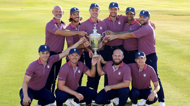 ABU DHABI, UNITED ARAB EMIRATES - JANUARY 12: The victorious Great Britain and Ireland team pose with the trophy (L-R standing) Paul Waring, Tommy Fleetwood, Justin Rose (captain) Laurie Canter, Aaron Rai and Jordan Smith (kneeling L-R) Matthew Jordan, Matt Wallace, Tyrrell Hatton and Tom McKibbin after the final day singles matches of the Team Cup at Abu Dhabi Golf Resort on January 12, 2025 in Abu Dhabi, United Arab Emirates.