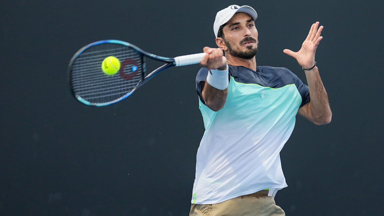 MELBOURNE, AUSTRALIA - JANUARY 12: Hady Habib of Lebanon plays a forehand in the Men's Singles First Round match against Yunchaokete Bu of China during day one of the 2025 Australian Open at Melbourne Park on January 12, 2025 in Melbourne, Australia.