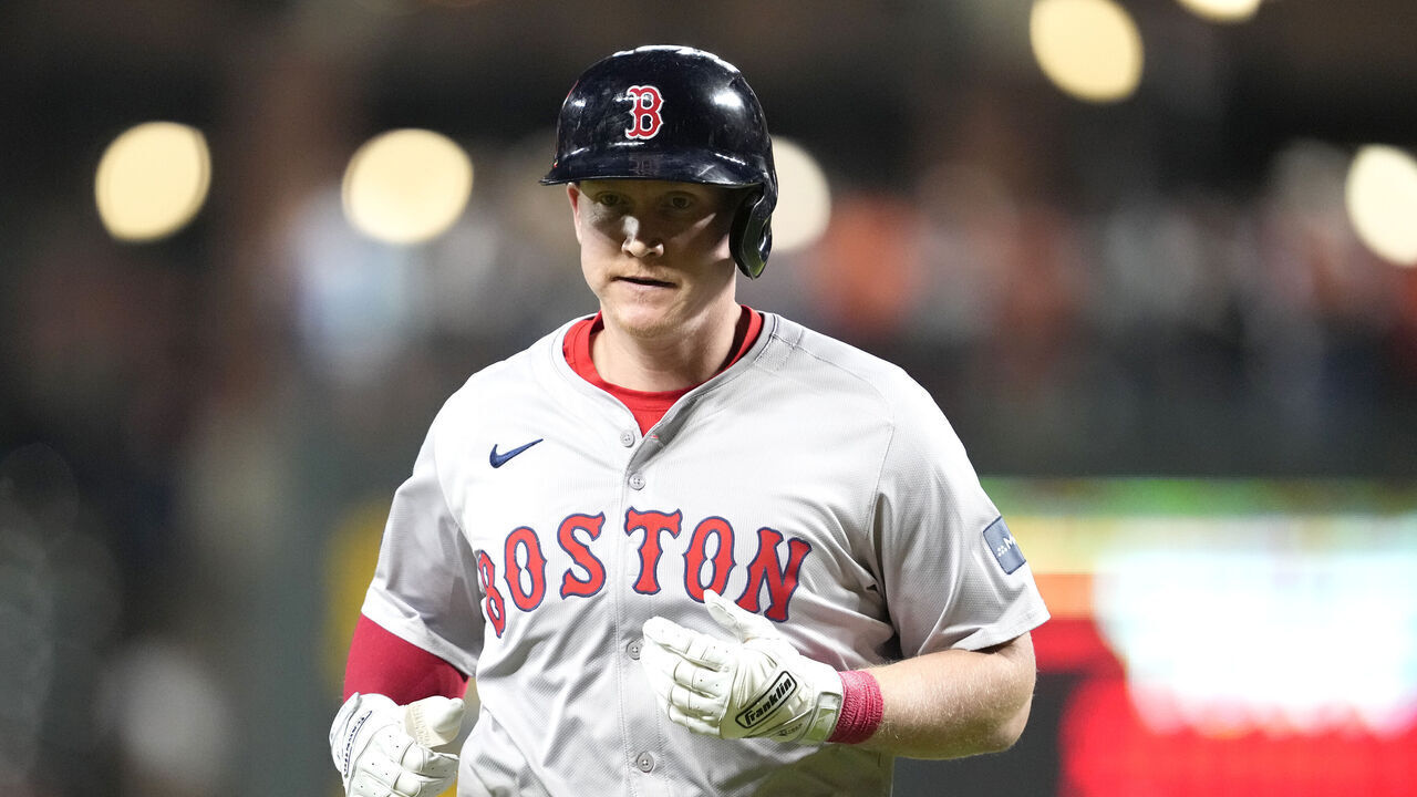 BALTIMORE, MARYLAND - MAY 29: Garrett Cooper #28 of the Boston Red Sox runs back to the dug out during a baseball game against the Baltimore Orioles at Oriole Park at Camden Yards on May 29, 2024 in Baltimore, Maryland.