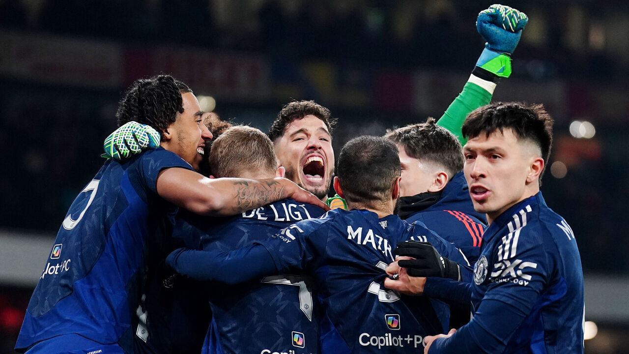 Manchester United goalkeeper Altay Bayindir (centre) celebrates with team-mates after winning the shoot-out during the Emirates FA Cup third round match at the Emirates Stadium, London. Picture date: Sunday January 12, 2025.