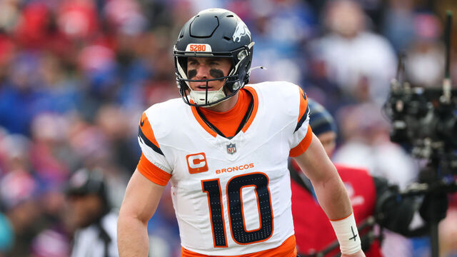 ORCHARD PARK, NEW YORK - JANUARY 12: Bo Nix #10 of the Denver Broncos celebrates after a touchdown against the Buffalo Bills during the first quarter during the AFC Wild Card Playoffs at Highmark Stadium on January 12, 2025 in Orchard Park, New York.