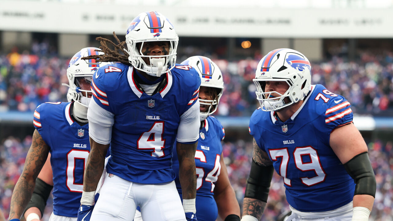 ORCHARD PARK, NEW YORK - JANUARY 12: James Cook #4 of the Buffalo Bills celebrates after scoring a touchdown against the Denver Broncos during the second quarter during the AFC Wild Card Playoffs at Highmark Stadium on January 12, 2025 in Orchard Park, New York.