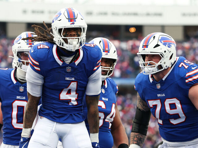 ORCHARD PARK, NEW YORK - JANUARY 12: James Cook #4 of the Buffalo Bills celebrates after scoring a touchdown against the Denver Broncos during the second quarter during the AFC Wild Card Playoffs at Highmark Stadium on January 12, 2025 in Orchard Park, New York.