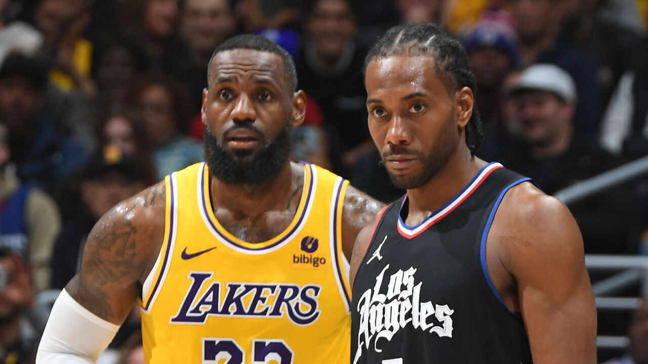 LOS ANGELES, CA - FEBRUARY 28: Kawhi Leonard #2 of the LA Clippers and LeBron James #23 of the Los Angeles Lakers look on during the game on February 28, 2024 at Crypto.Com Arena in Los Angeles, California. NOTE TO USER: User expressly acknowledges and agrees that, by downloading and/or using this Photograph, user is consenting to the terms and conditions of the Getty Images License Agreement. Mandatory Copyright Notice: Copyright 2024 NBAE