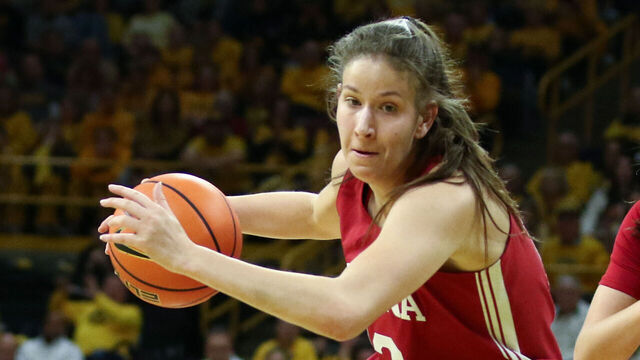 IOWA CITY, IOWA- JANUARY 12: Guard Yarden Garzon #12 of the Indiana Hoosiers goes to the basket during the first half against center adds O'Grady #44 of the Iowa Hawkeyes of the Indiana Hoosiers, at Carver-Hawkeye Arena on January 12, 2025 in Iowa City, Iowa.