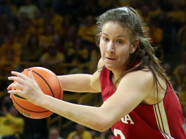 IOWA CITY, IOWA- JANUARY 12: Guard Yarden Garzon #12 of the Indiana Hoosiers goes to the basket during the first half against center adds O'Grady #44 of the Iowa Hawkeyes of the Indiana Hoosiers, at Carver-Hawkeye Arena on January 12, 2025 in Iowa City, Iowa.