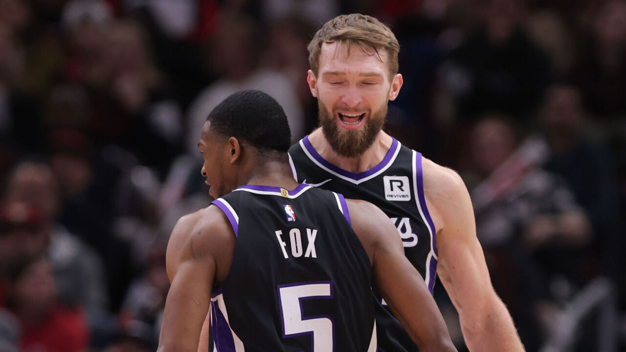 CHICAGO, IL - JANUARY 12: Domantas Sabonis #11 of the Sacramento Kings celebrates with De'Aaron Fox #5 of the Sacramento Kings during the second half against the Chicago Bulls on January 12, 2025 at the United Center in Chicago, Illinois.