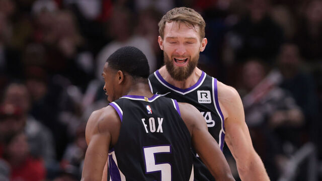 CHICAGO, IL - JANUARY 12: Domantas Sabonis #11 of the Sacramento Kings celebrates with De'Aaron Fox #5 of the Sacramento Kings during the second half against the Chicago Bulls on January 12, 2025 at the United Center in Chicago, Illinois.