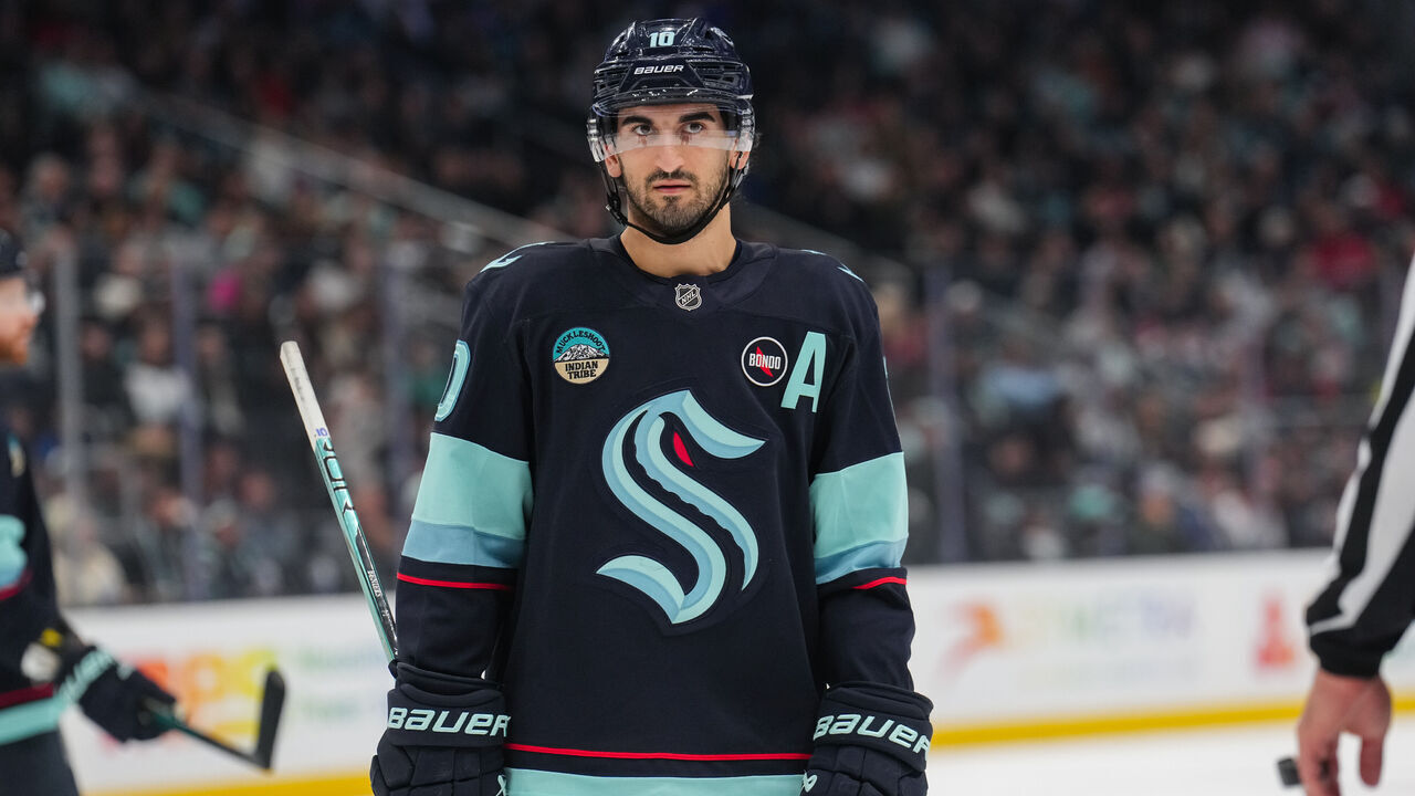 SEATTLE, WASHINGTON - JANUARY 06: Matty Beniers #10 of the Seattle Kraken looks on during the first period of a game against the New Jersey Devils at Climate Pledge Arena on January 06, 2025 in Seattle, Washington.
