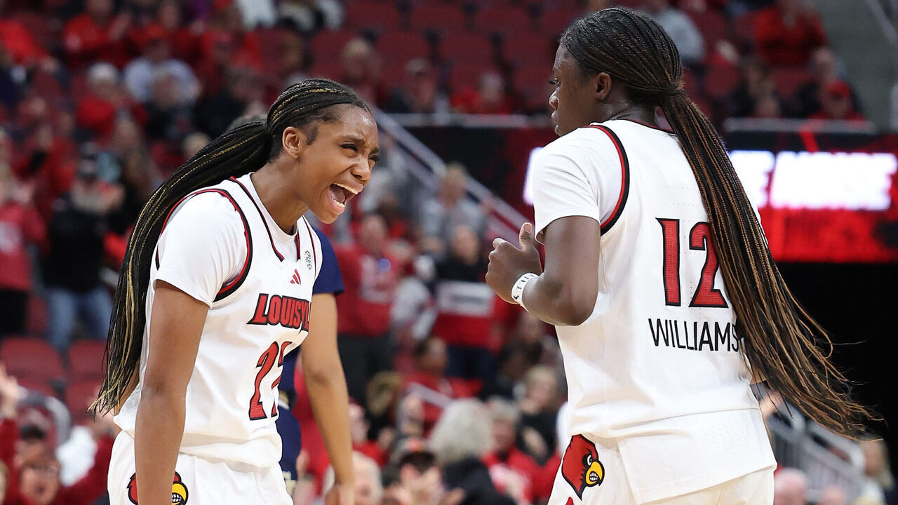 LOUISVILLE, KENTUCKY - JANUARY 12: Tajianna Roberts #22 Ja'Leah Williams #12 of the Louisville Cardinals celebrate during the 69-60 win against the Georgia Tech Yellow Jackets at KFC YUM! Center on January 12, 2025 in Louisville, Kentucky.