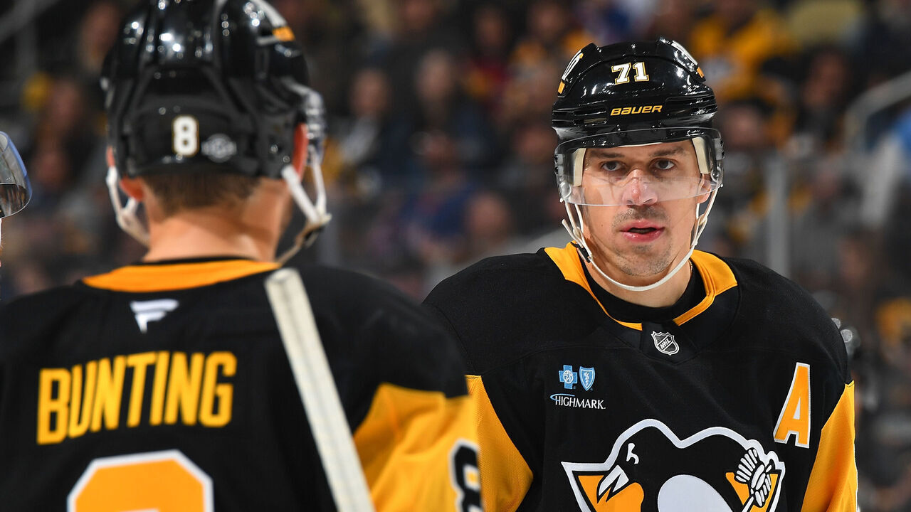 PITTSBURGH, PA - OCTOBER 9: Evgeni Malkin #71 of the Pittsburgh Penguins talks with Michael Bunting #8 during the game against the New York Rangers at PPG PAINTS Arena on October 9, 2024 in Pittsburgh, Pennsylvania.