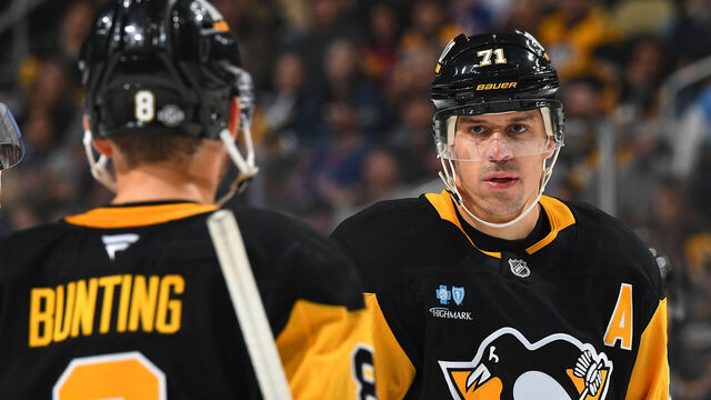 PITTSBURGH, PA - OCTOBER 9: Evgeni Malkin #71 of the Pittsburgh Penguins talks with Michael Bunting #8 during the game against the New York Rangers at PPG PAINTS Arena on October 9, 2024 in Pittsburgh, Pennsylvania.
