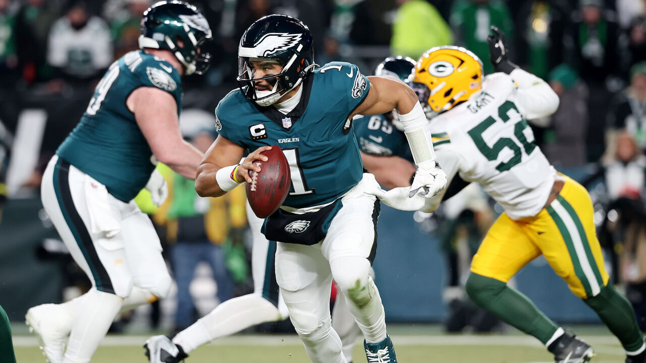 PHILADELPHIA, PENNSYLVANIA - JANUARY 12: Jalen Hurts #1 of the Philadelphia Eagles runs with the ball in the second quarter against the Green Bay Packers during the NFC Wild Card Playoff at Lincoln Financial Field on January 12, 2025 in Philadelphia, Pennsylvania.
