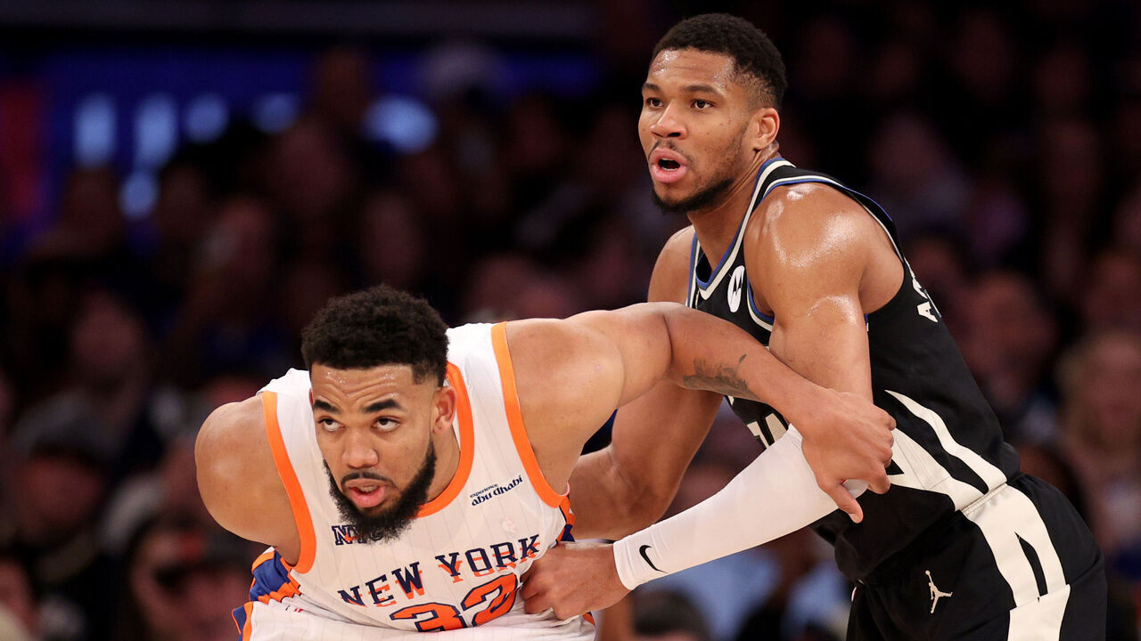 NEW YORK, NEW YORK - JANUARY 12: Karl-Anthony Towns #32 of the New York Knicks boxes out Giannis Antetokounmpo #34 of the Milwaukee Bucks during the second half at Madison Square Garden on January 12, 2025 in New York City.