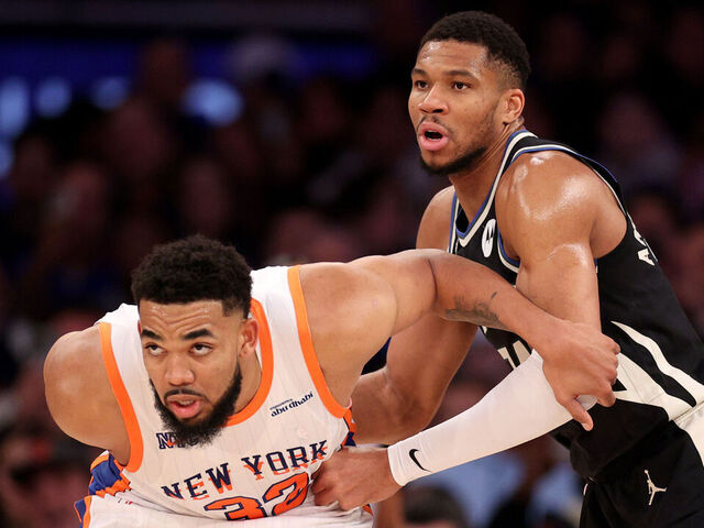 NEW YORK, NEW YORK - JANUARY 12: Karl-Anthony Towns #32 of the New York Knicks boxes out Giannis Antetokounmpo #34 of the Milwaukee Bucks during the second half at Madison Square Garden on January 12, 2025 in New York City.