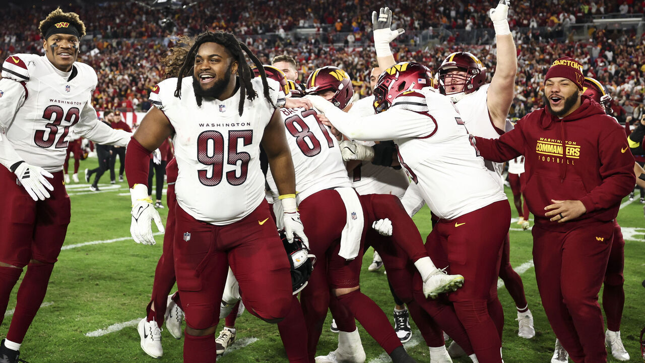 TAMPA, FLORIDA - JANUARY 12: Jer'Zhan Newton #95 of the Washington Commanders celebrates with teammates after an NFL football wild card playoff game against the Tampa Bay Buccaneers at Raymond James Stadium on January 12, 2025 in Tampa, Florida.
