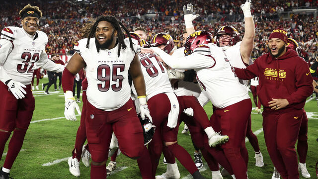 TAMPA, FLORIDA - JANUARY 12: Jer'Zhan Newton #95 of the Washington Commanders celebrates with teammates after an NFL football wild card playoff game against the Tampa Bay Buccaneers at Raymond James Stadium on January 12, 2025 in Tampa, Florida.