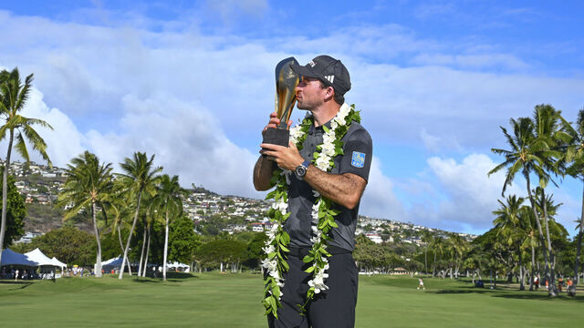 HONOLULU, HAWAII - JANUARY 12: Nick Taylor of Canada kisses the trophy after the final round of the Sony Open in Hawaii at Waialae Country Club on January 12, 2025 in Honolulu, Hawaii.