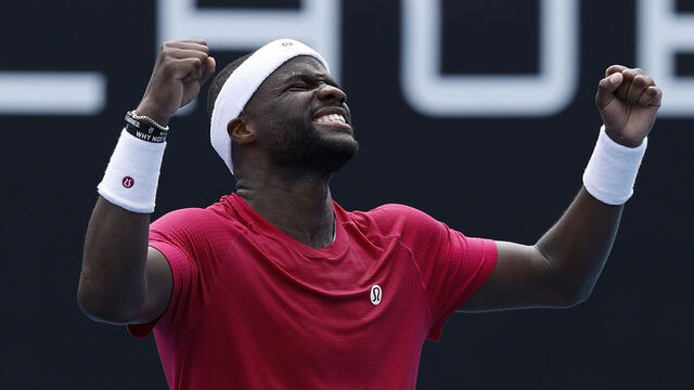 MELBOURNE, AUSTRALIA - JANUARY 13: Frances Tiafoe of the United States celebrates winning the Men's Singles First Round match against Arthur Rinderknech of France during day two of the 2025 Australian Open at Melbourne Park on January 13, 2025 in Melbourne, Australia.