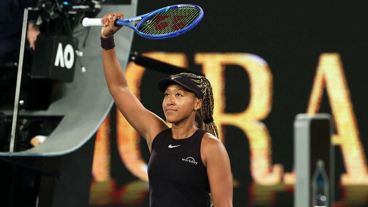 Japan's Naomi Osaka celebrates beating France's Caroline Garcia in their women's singles match on day two of the Australian Open tennis tournament in Melbourne on January 14, 2025.