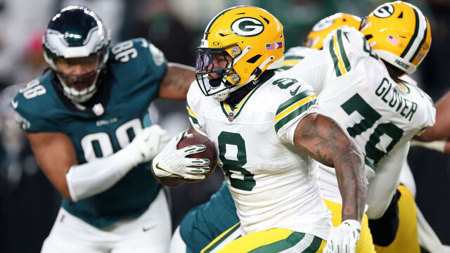 PHILADELPHIA, PENNSYLVANIA - JANUARY 12: Josh Jacobs #8 of the Green Bay Packers runs against the Philadelphia Eagles during their NFC Wild Card Playoff Game at Lincoln Financial Field on January 12, 2025 in Philadelphia, Pennsylvania.
