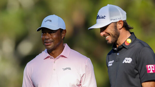 PINEHURST, NORTH CAROLINA - JUNE 11: Tiger Woods of the United States and Max Homa of the United States react on the third green during a practice round prior to the U.S. Open at Pinehurst Resort on June 11, 2024 in Pinehurst, North Carolina.