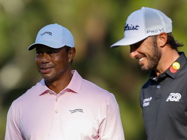 PINEHURST, NORTH CAROLINA - JUNE 11: Tiger Woods of the United States and Max Homa of the United States react on the third green during a practice round prior to the U.S. Open at Pinehurst Resort on June 11, 2024 in Pinehurst, North Carolina.