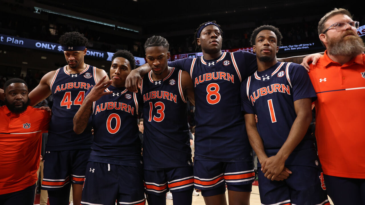 COLUMBIA, SOUTH CAROLINA - JANUARY 11: Dylan Cardwell #44, Tahaad Pettiford #0, Miles Kelly #13, Ja'Heim Hudson #8 and JP Pegues #1 of the Auburn Tigers gather together after the win against the South Carolina Gamecocks 66-63 at Colonial Life Arena on January 11, 2025 in Columbia, South Carolina.