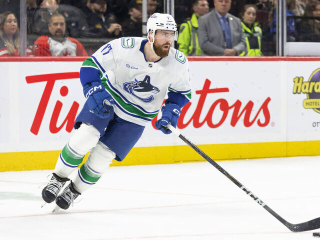 OTTAWA, ON - NOVEMBER 23: Vancouver Canucks Defenceman Filip Hronek (17) skates with the puck during third period National Hockey League action between the Vancouver Canucks and Ottawa Senators on November 23, 2024, at Canadian Tire Centre in Ottawa, ON, Canada.