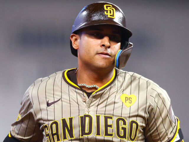 MIAMI, FLORIDA - AUGUST 11: Donovan Solano #39 of the San Diego Padres rounds the bases after hitting a home run against the Miami Marlins during the eighth inning of the game at loanDepot park on August 11, 2024 in Miami, Florida.