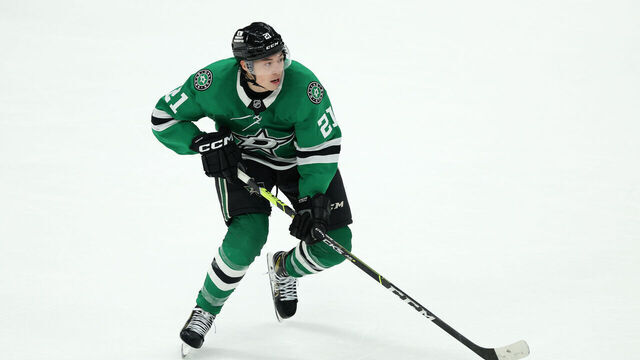 DALLAS, TEXAS - JANUARY 04: Jason Robertson #21 of the Dallas Stars skates with the puck during overtime against the Utah Hockey Club at American Airlines Center on January 04, 2025 in Dallas, Texas.
