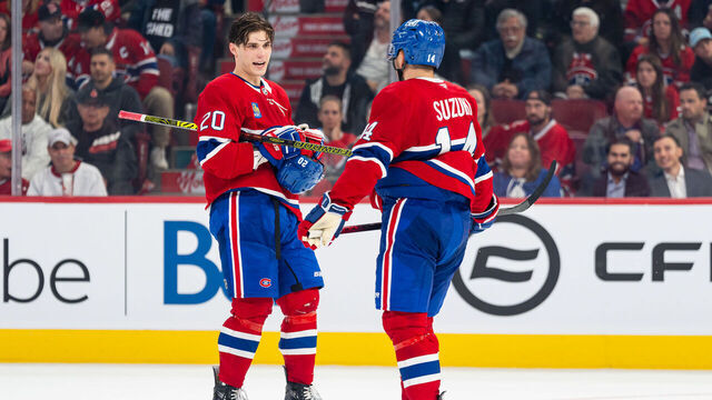 MONTREAL, CANADA - OCTOBER 9: Juraj Slafkovsky #20 of the Montreal Canadiens talks with Nick Suzuki #14 of the Montreal Canadiens during the third period of the NHL regular season game between the Montreal Canadiens and the Toronto Maple Leafs at the Bell Centre on October 9, 2024 in Montreal, Quebec, Canada.