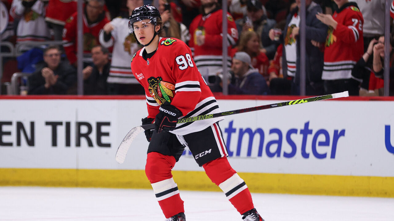 CHICAGO, IL - JANUARY 13: Connor Bedard #98 of the Chicago Blackhawks skates back to the bench after scoring a goal during the second period against the Calgary Flames on January 13, 2025 at the United Center in Chicago, Illinois.
