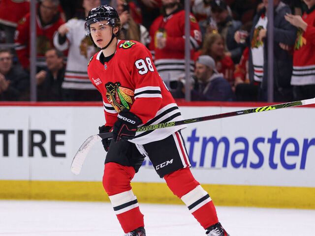 CHICAGO, IL - JANUARY 13: Connor Bedard #98 of the Chicago Blackhawks skates back to the bench after scoring a goal during the second period against the Calgary Flames on January 13, 2025 at the United Center in Chicago, Illinois.