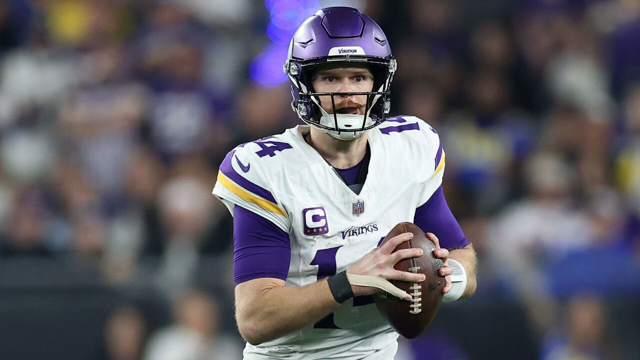 GLENDALE, ARIZONA - JANUARY 13: Sam Darnold #14 of the Minnesota Vikings scrambles during the third quarter against the Los Angeles Rams during the NFC Wild Card Playoff at State Farm Stadium on January 13, 2025 in Glendale, Arizona.
