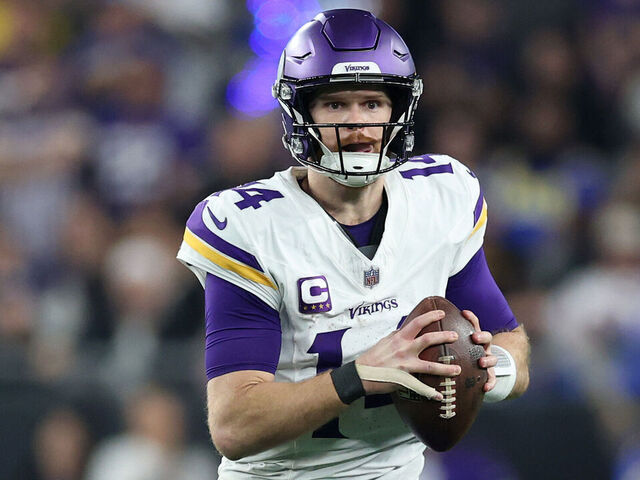 GLENDALE, ARIZONA - JANUARY 13: Sam Darnold #14 of the Minnesota Vikings scrambles during the third quarter against the Los Angeles Rams during the NFC Wild Card Playoff at State Farm Stadium on January 13, 2025 in Glendale, Arizona.