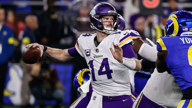 GLENDALE, AZ - JANUARY 13: Minnesota Vikings quarterback Sam Darnold (14) throws a pass under pressure during the NFL Wild Card Playoff football game between the Minnesota Vikings and the Los Angeles Rams on January 13, 2025, at State Farm Stadium in Glendale, AZ.