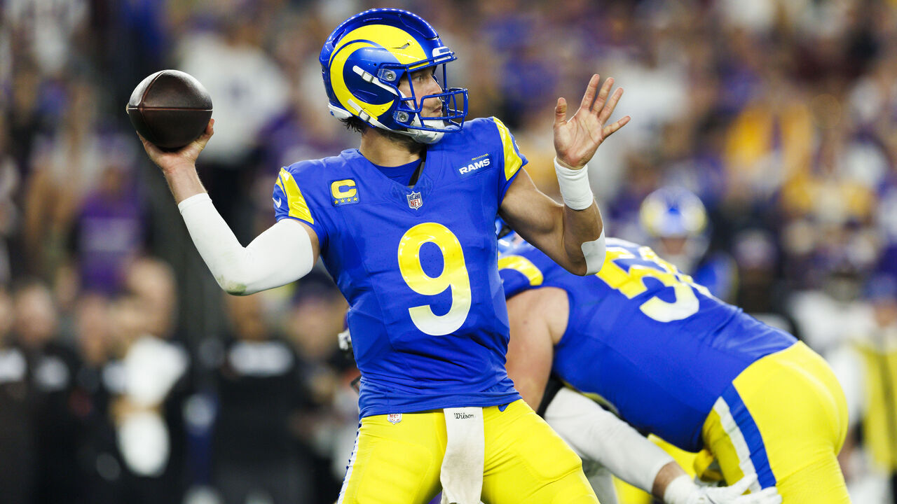 GLENDALE, ARIZONA - JANUARY 13: Matthew Stafford #9 of the Los Angeles Rams throws during the first half of the NFC Wild Card Playoff game against the Minnesota Vikings at State Farm Stadium on January 13, 2025 in Glendale, Arizona.