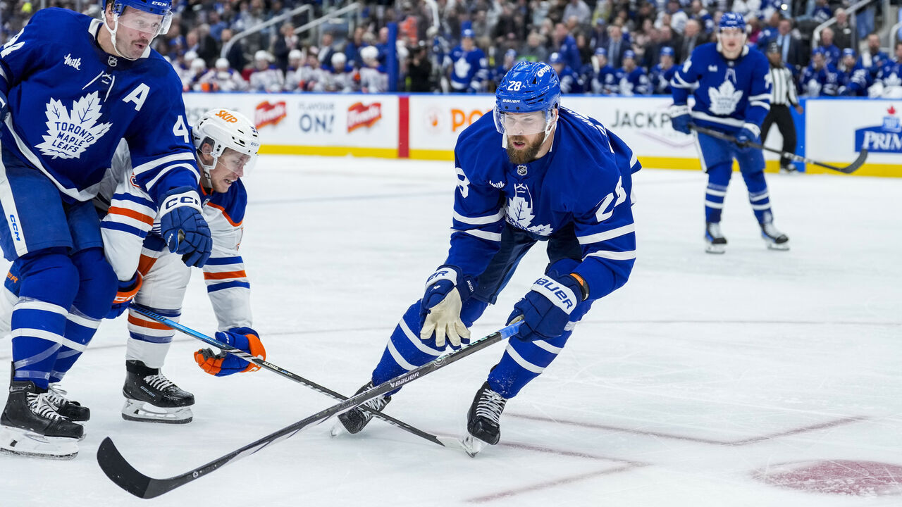 TORONTO, ON - NOVEMBER 16: Jani Hakanpää #28 of the Toronto Maple Leafs chases after the puck against the Edmonton Oilers during the third period at Scotiabank Arena on November 16, 2024 in Toronto, Ontario, Canada.