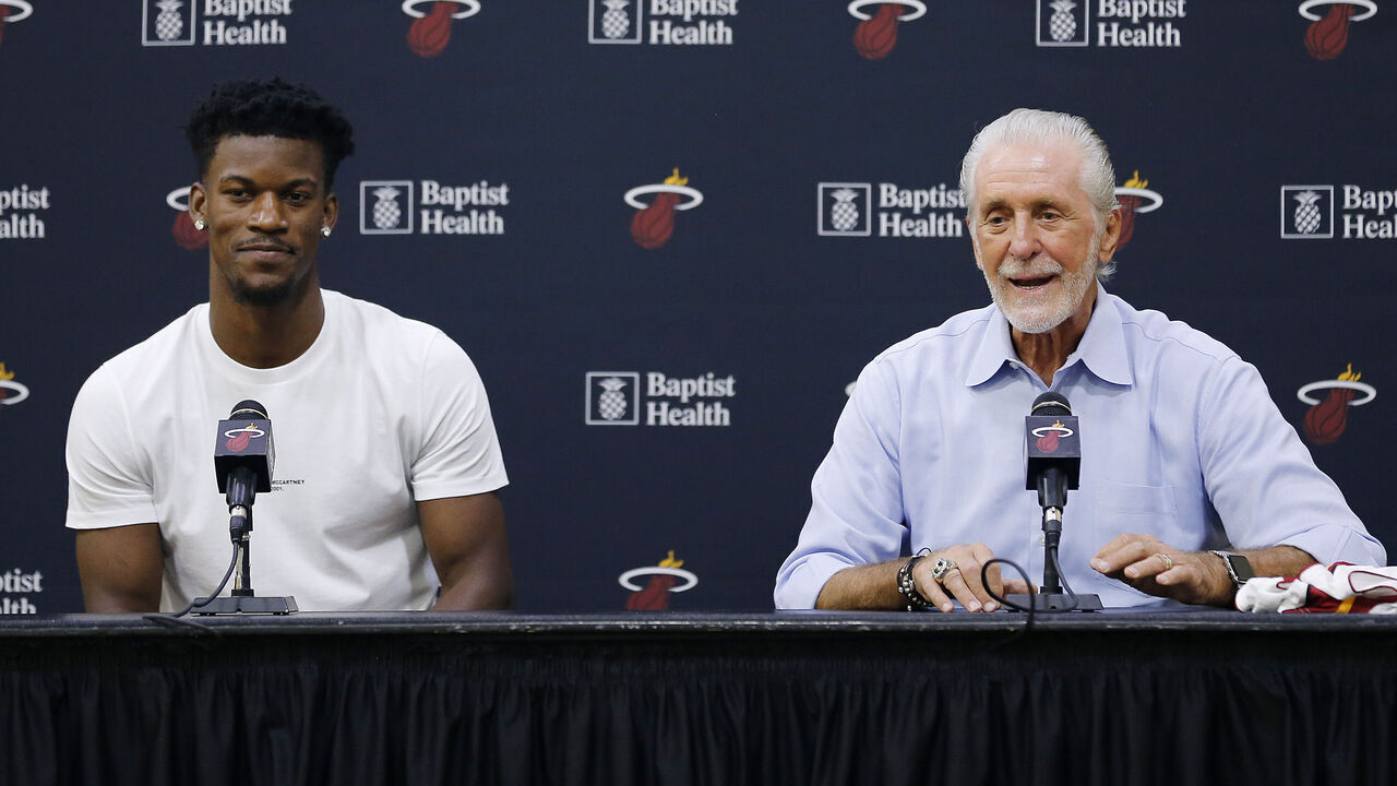 MIAMI, FLORIDA - SEPTEMBER 27: Jimmy Butler #22 of the Miami Heat and president Pat Riley speak to the media during his introductory press conference at American Airlines Arena on September 27, 2019 in Miami, Florida.