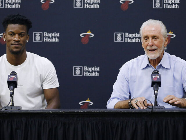 MIAMI, FLORIDA - SEPTEMBER 27: Jimmy Butler #22 of the Miami Heat and president Pat Riley speak to the media during his introductory press conference at American Airlines Arena on September 27, 2019 in Miami, Florida.