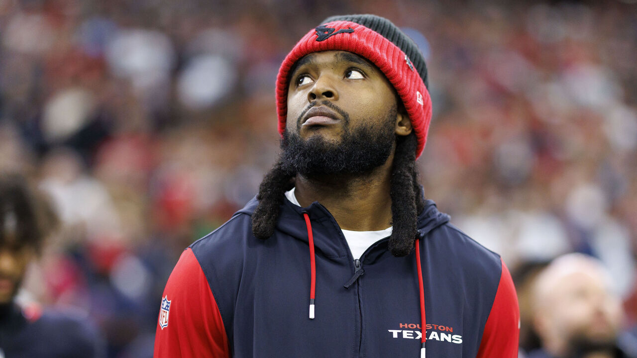 HOUSTON, TEXAS - DECEMBER 25: Wide receiver Diontae Johnson #18 of the Houston Texans stands on the sidelines during the national anthem prior to an NFL football game against the Baltimore Ravens, at NRG Stadium on December 25, 2024 in Houston, Texas.