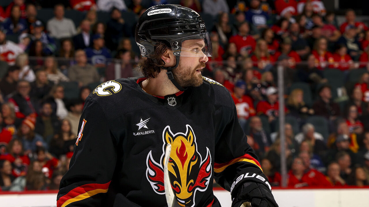 CALGARY, AB - DECEMBER 31: Rasmus Andersson #4 of the Calgary Flames prepares to face off against the Vancouver Canucks at Scotiabank Saddledome on December 31, 2024 in Calgary, Alberta, Canada.
