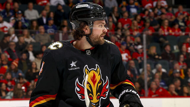 CALGARY, AB - DECEMBER 31: Rasmus Andersson #4 of the Calgary Flames prepares to face off against the Vancouver Canucks at Scotiabank Saddledome on December 31, 2024 in Calgary, Alberta, Canada.