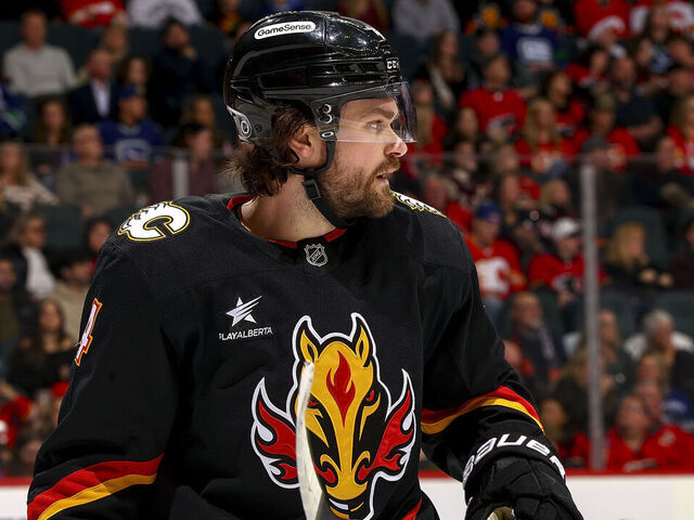 CALGARY, AB - DECEMBER 31: Rasmus Andersson #4 of the Calgary Flames prepares to face off against the Vancouver Canucks at Scotiabank Saddledome on December 31, 2024 in Calgary, Alberta, Canada.