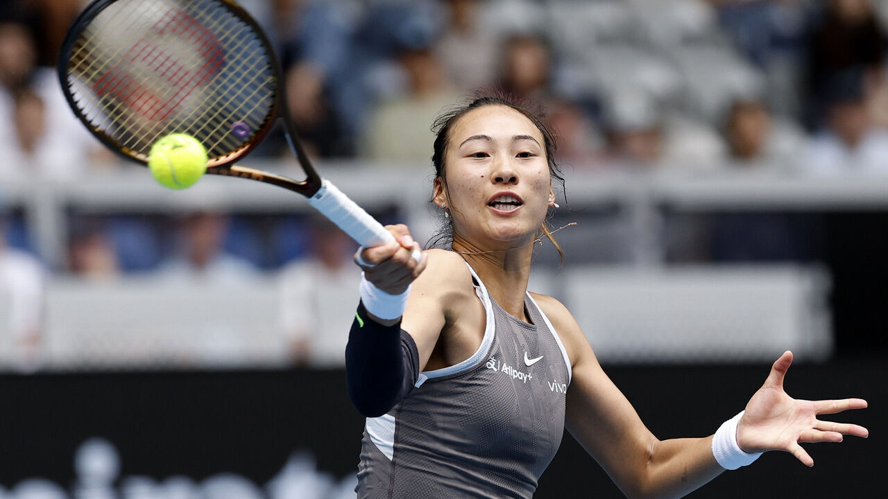 MELBOURNE, AUSTRALIA - JANUARY 15: Qinwen Zheng of China plays a forehand against Laura Siegemund of Germany in the Women's Singles Second Round match during day four of the 2025 Australian Open at Melbourne Park on January 15, 2025 in Melbourne, Australia.