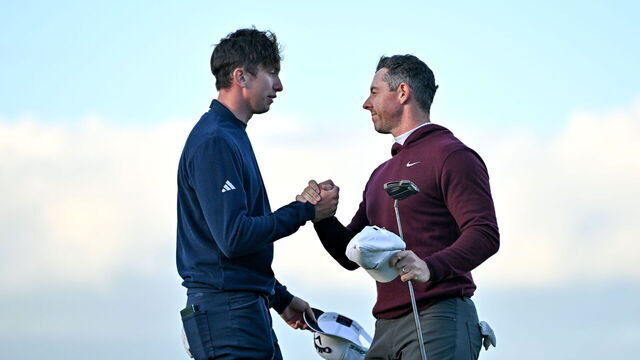 Down , United Kingdom - 12 September 2024; Rory McIlroy of Northern Ireland, right, and Tom McKibbin of Northern Ireland shake hands after finishing on the 18th green during day one of the Amgen Irish Open Golf Championship 2024 at the Royal County Down Golf Club in Newcastle, Down.