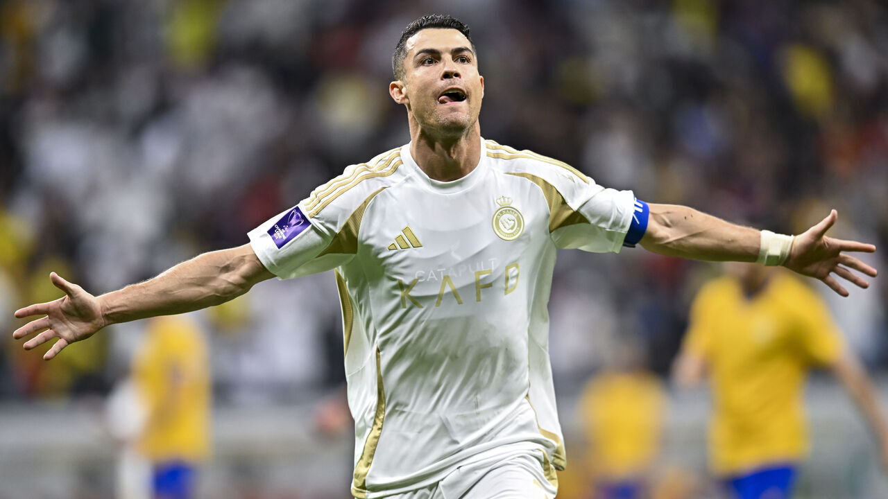 Cristiano Ronaldo of Al Nassr FC celebrates after scoring a goal during the AFC Champions League elite west football match between Qatar's Al Gharafa SC and Saudi Arabia's Al Nassr FC at Al-Bayt Stadium in Al Khor, Qatar, on November 25, 2024.