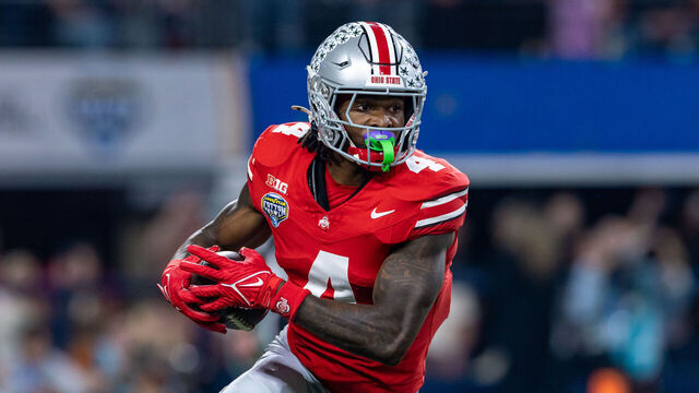 ARLINGTON, TX - JANUARY 10: Ohio State Buckeyes wide receiver Jeremiah Smith (#4) runs up field after making a catch during the CFP Semifinal Cotton Bowl Classic football game between the Ohio State Buckeyes and Texas Longhorns on January 10, 2025 at AT&T Stadium in Arlington, TX.