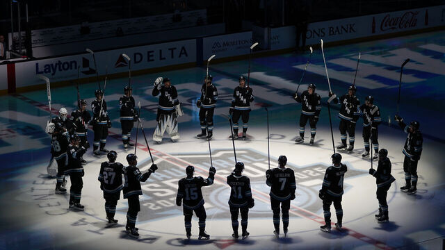 SALT LAKE CITY, UT - OCTOBER 08: The Utah Hockey Club salutes fans before its inaugural game against the Chicago Blackhawks on October 08, 2024, at the Delta Center in Salt Lake City, UT.